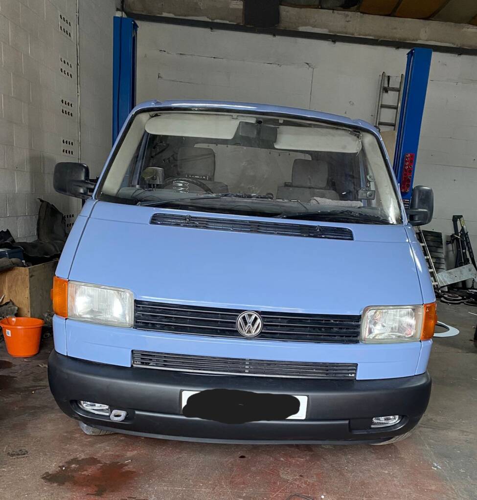 VW T4 full respray front view showing fresh light blue paint finish